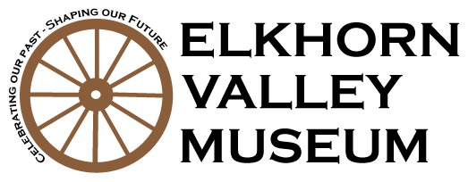 Wagon wheel logo with Elkhorn Valley Museum spelled out