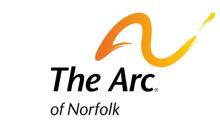 The logo features a stylized orange arc that rises from left to right, curving like a rainbow. Beneath the arc, the words "The Arc of Norfolk" are written in bold black letters, with "The Arc" in larger font and "of Norfolk" in smaller text below it. The arc symbolizes support, inclusion, and a hopeful future for people with intellectual and developmental disabilities.